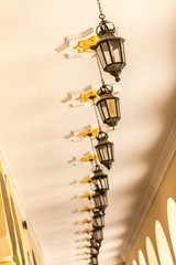 A ceiling with lamps in a mosque