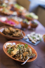 Weird food on a plate on a purple tablecloth