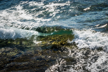 Blue sea and small wave, Crystal Clear sea over a reef in the mediterranean