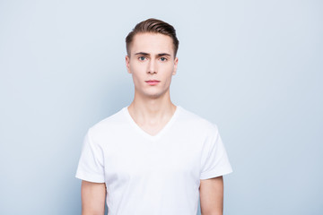 Portrait of nice, good-looking young man look at camera stand is