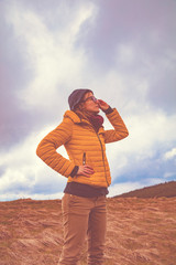 Confident woman looking at the distant landscape.