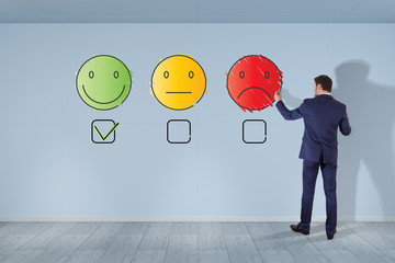 Businessman drawing thin line customer satisfaction rating on the wall