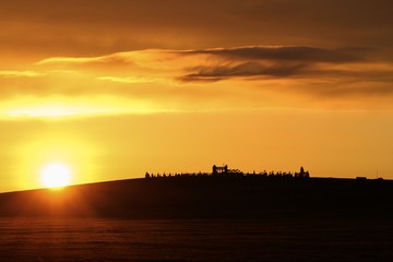 Mongolian sunrise over horse monument