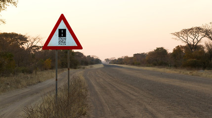 Sign gravel road - Caution the end of a gravel road