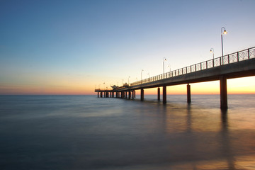 Fototapeta na wymiar bridge after the sunset in versilia