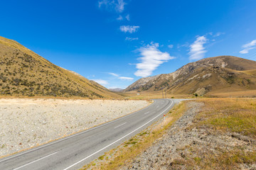 Beautiful scenic summer mountain view and asphalt ways in arthur pass national park south island New Zealand