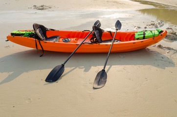 orange kayak on the beach, Samed island Thailand.