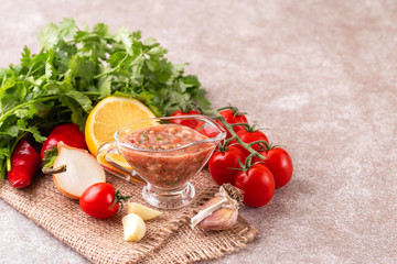 Traditional mexican red spicy sauce with ingredients