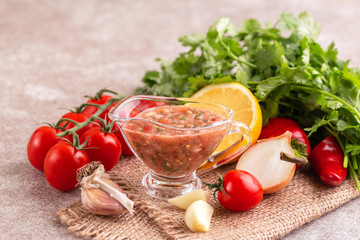 Traditional mexican red spicy sauce with ingredients