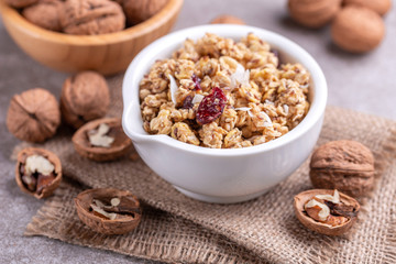 Bowl of homemade granola with nuts. Copy space