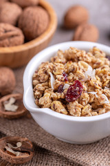 Bowl of homemade granola with nuts. Copy space