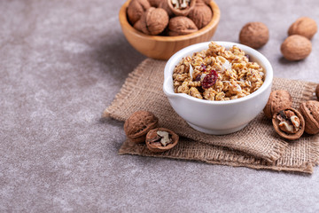 Bowl of homemade granola with nuts. Copy space