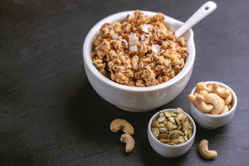 Bowl of homemade granola with nuts. Copy space