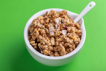 Bowl of homemade granola with nuts. Copy space
