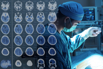 veterinarian surgery in operation room with images from a computerized tomography of the brain take...