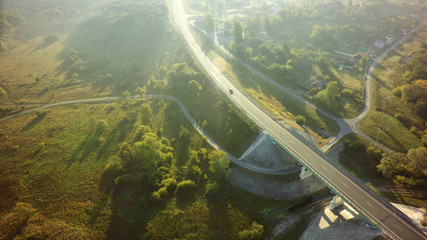 road for cars aerial view from top around green nature