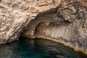 Natural caves formation by the sea in Malta at Comino