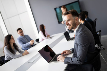 Portrait of young businessman, successful entrepreneur working day in office