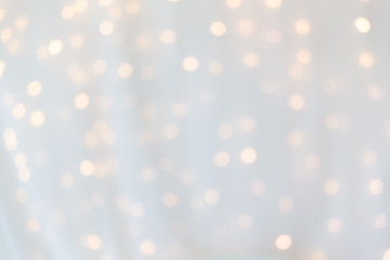 bokeh of yellow led light under curtain.