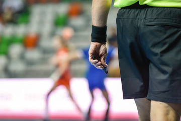 handball referee hand with whistle
