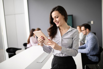 Business colleagues in conference meeting room during presentation