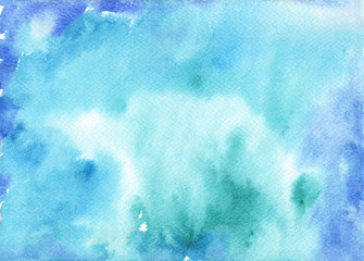Abstract blue watercolor background. Texture of painted aquarelle paper.