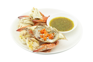 steamed crab roe and claws with seafood sauce on white background
