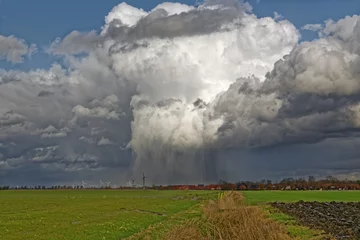 Fotobehang Regenwolken ziehen über das Land © Rolf