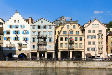 Fototapeta na wymiar Beautiful cityscape of Zurich, Switzerland, with traditional houses, seen from the shore of the river Limmat in summer 
