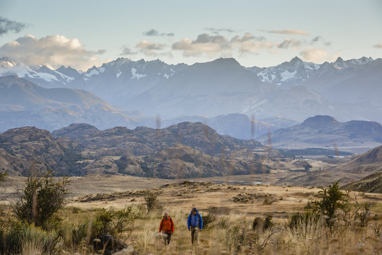 hikers at Chacabuco Valley with a view over the Jeinimeni Mountain peaks, Parque Patagonia, AysŽn Region, Chile.