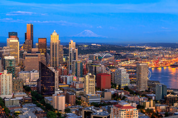 Seattle skyline panorama in blue hour with Mt. Rainier in background as seen from Space Needle Tower, Seattle, Washington, USA. Travel USA.