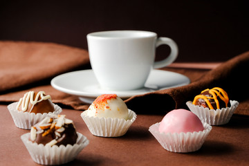 A cup of coffee and handmade truffles,