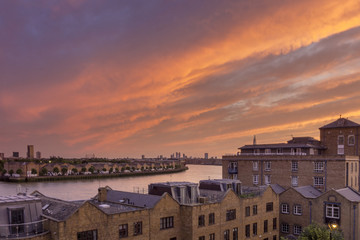 Fototapeta na wymiar Canary wharf riverside sunset cloudscape view, London city.