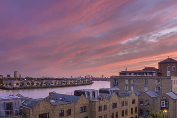 Canary wharf riverside sunset cloudscape view, London city.