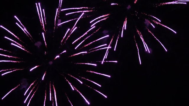 Firework display. New Year celebration fireworks. Christmas background. 4K UHD