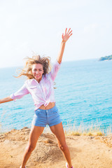 portrait smiling happy girl having fun jump up