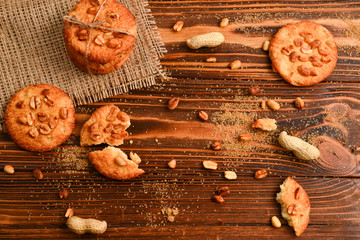 Peanut cookies on wooden table with sugar.