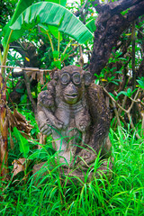 Indonesian historical statue nearby the beach of the Bali island, Indonesia. Bali is an Indonesian island and known as a tourist destination. In Bali, rice harvest seasons come three times in a year.