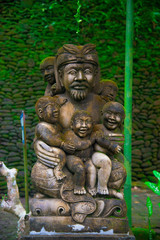 Indonesian historical statue nearby the beach of the Bali island, Indonesia. Bali is an Indonesian island and known as a tourist destination. In Bali, rice harvest seasons come three times in a year.