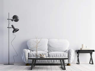 Empty white wall in modern interior with white sofa and white floor & low table.