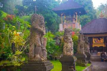 Indonesian historical statue nearby the beach of the Bali island, Indonesia. Bali is an Indonesian island and known as a tourist destination. In Bali, rice harvest seasons come three times in a year.