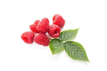 Ripe raspberries with leaf isolated on white background.