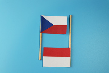 A national flag of Czech republic with national flag of Poland on wooden sticks