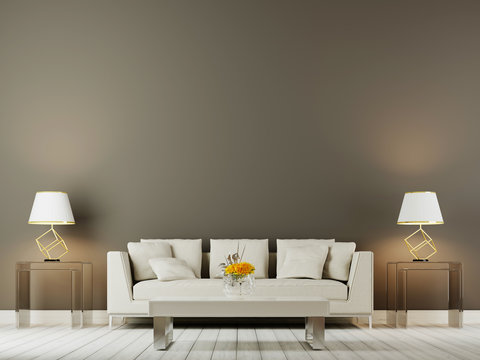 table lamp above beige sofa in sophisticated living room interior with side table on a empty wall background.