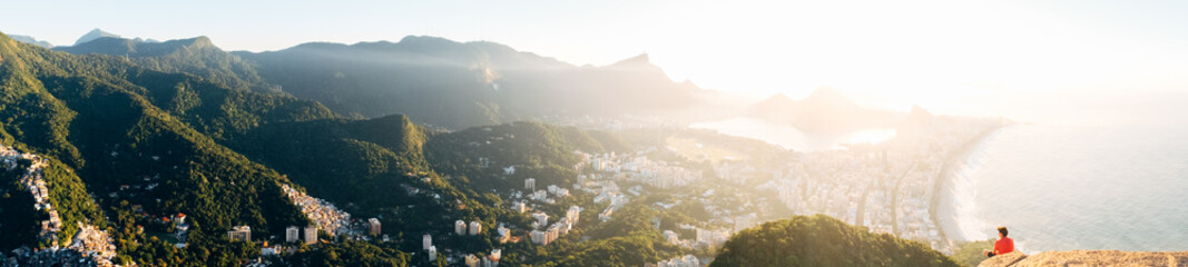 Fototapeta na wymiar Rio de Janeiro, Brazil. The mountain is two brothers. View of the morning city, hills, mountains, lake, ocean. panarama