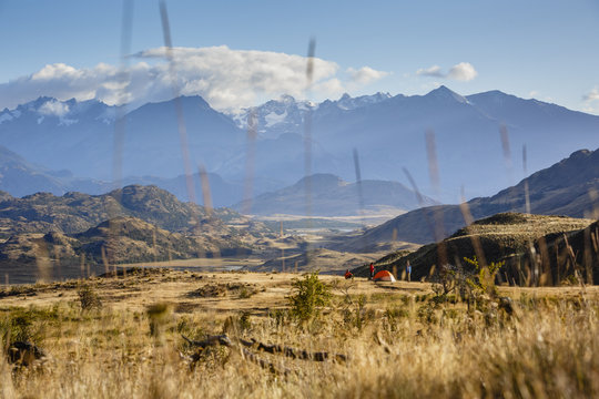 hikers and camp at Chacabuco Valley with a view over the Jeinimeni Mountain peaks, Parque Patagonia, AysŽn Region, Chile.