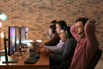 Young people playing video games at tournament