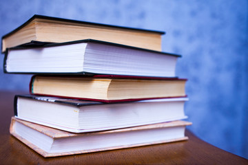 stack of book on the wooden desk