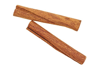 Top view of two cinnamon sticks on white background, close-up. Cassia.