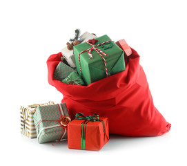 Santa Claus bag full of gifts on white background